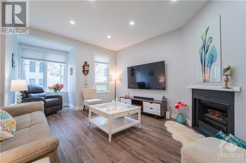 8 Shehyn Lane Unit#A, Ottawa, ON - Indoor Photo Showing Living Room With Fireplace