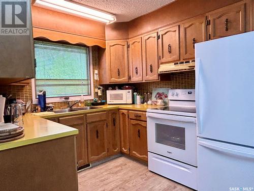 9028 Mitchell Avenue, North Battleford, SK - Indoor Photo Showing Kitchen With Double Sink