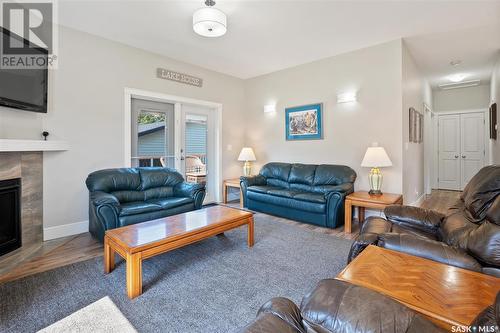 335 Venture Road, Pebble Baye, SK - Indoor Photo Showing Living Room With Fireplace