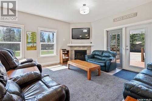 335 Venture Road, Pebble Baye, SK - Indoor Photo Showing Living Room With Fireplace