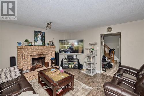 24 Tomahawk Drive, Grimsby, ON - Indoor Photo Showing Living Room With Fireplace