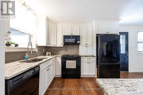 75 Riverside Drive, Kawartha Lakes, ON - Indoor Photo Showing Kitchen With Double Sink