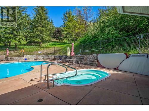 7922 Okanagan Landing Road Unit# 404, Vernon, BC - Outdoor With In Ground Pool With Backyard