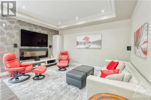 5 surround speakers included! - 577 Foxview Place, Ottawa, ON - Indoor Photo Showing Living Room With Fireplace