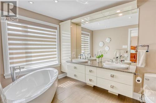 Lovely free standing soaker tub plus double sinks - 577 Foxview Place, Ottawa, ON - Indoor Photo Showing Bathroom