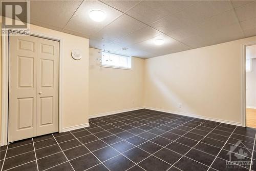 At the bottom of the stairs is a great room for the kids' hangout space or man cave. - 400 Van Dusen Street, Almonte, ON - Indoor Photo Showing Other Room