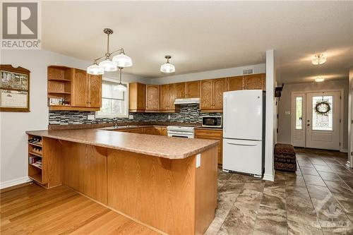 Beautiful kitchen with miles of counter space, and a nice long penninsula for bar stools. - 400 Van Dusen Street, Almonte, ON - Indoor Photo Showing Kitchen