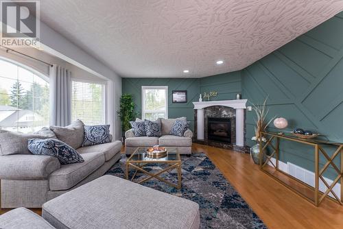 8219 St Patrick Avenue, Prince George, BC - Indoor Photo Showing Living Room With Fireplace