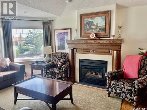 14281 Battle Springs Way, Battleford, SK - Indoor Photo Showing Living Room With Fireplace