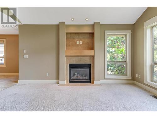 561 Still Pond Lane, Kelowna, BC - Indoor Photo Showing Living Room With Fireplace
