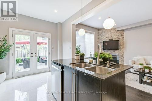 2388 Stone Glen Crescent, Oakville, ON - Indoor Photo Showing Kitchen With Fireplace With Double Sink
