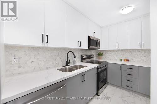 1076 - 100 Mornelle Court, Toronto, ON - Indoor Photo Showing Kitchen With Double Sink