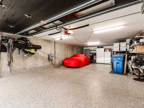 Garage - 7-303 Rue De L'Aigle, Carignan, QC - Indoor Photo Showing Other Room