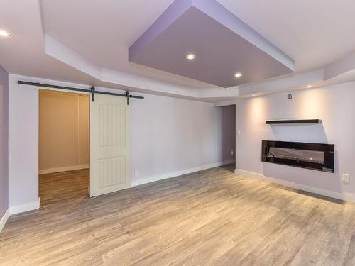 7246 Dunwaters Drive, Kelowna, BC - Indoor Photo Showing Other Room With Fireplace