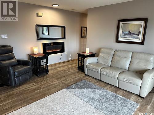 101 453 Walsh Trail, Swift Current, SK - Indoor Photo Showing Living Room With Fireplace