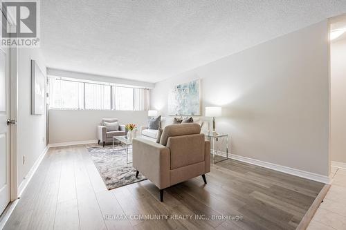 103 - 10 Tapscott Road, Toronto, ON - Indoor Photo Showing Living Room