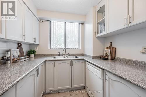103 - 10 Tapscott Road, Toronto, ON - Indoor Photo Showing Kitchen With Double Sink