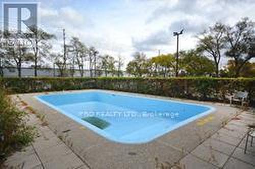 703 - 3065 Queen Frederica Drive, Mississauga, ON - Outdoor With In Ground Pool With Backyard