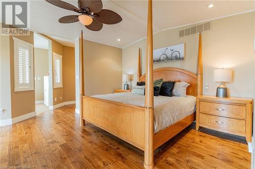 Primary Bedroom facing Lake Huron - Main Floor - 26 Green Cedar Drive, Stokes Bay, ON - Indoor Photo Showing Bedroom