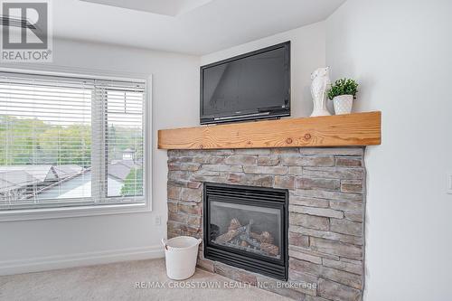 308 - 130 Steamship Bay Road, Gravenhurst, ON - Indoor Photo Showing Living Room With Fireplace