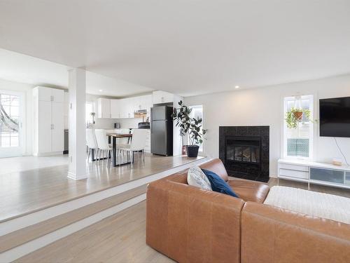 Overall view - 168 Ch. Du Fleuve, Coteau-Du-Lac, QC - Indoor Photo Showing Living Room With Fireplace