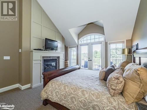 3876 Muskoka Rd Hwy 118 W Unit# Sandfield 4 Week 5, Port Carling, ON - Indoor Photo Showing Bedroom With Fireplace