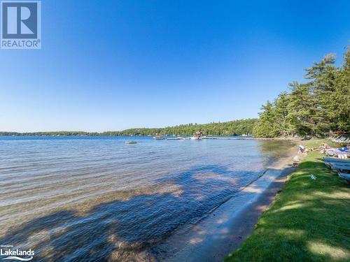 Beach - 3876 Muskoka Rd Hwy 118 W Unit# Sandfield 4 Week 5, Port Carling, ON - Outdoor With Body Of Water With View