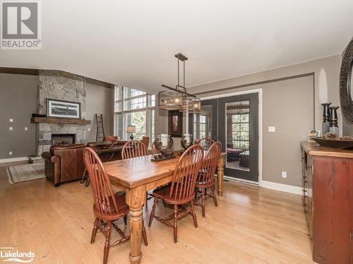 3876 Muskoka Rd Hwy 118 W Unit# Sandfield 4 Week 5, Port Carling, ON - Indoor Photo Showing Dining Room With Fireplace