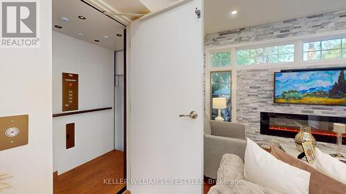 Elevator in L:iving Room - 16 - 519 Riverside Drive, London, ON - Indoor Photo Showing Other Room With Fireplace