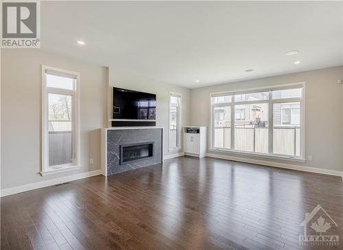 874 Moses Tennisco Street, Ottawa, ON - Indoor Photo Showing Living Room With Fireplace
