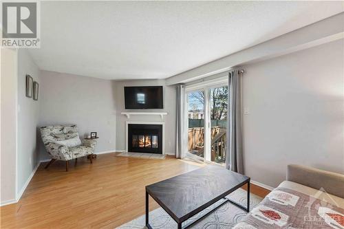 32 Mcdermot Court, Kanata, ON - Indoor Photo Showing Living Room With Fireplace