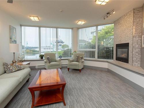 304-154 Promenade Dr, Nanaimo, BC - Indoor Photo Showing Living Room With Fireplace