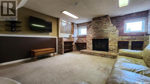 1239 Devonshire Drive, Regina, SK - Indoor Photo Showing Living Room With Fireplace
