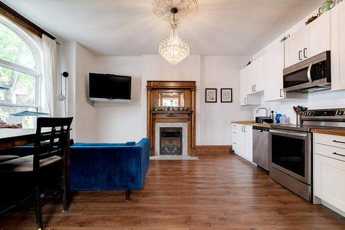 Unit 1 - Front Unit (virtually rendered) - 54 West Avenue N, Hamilton, ON - Indoor Photo Showing Kitchen With Fireplace