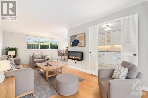 Virtually Staged - 1505 Baseline Road Unit#104, Ottawa, ON - Indoor Photo Showing Living Room With Fireplace