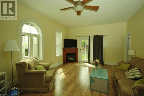 BEAUTIFUL WINDOWS AND FRENCH DOOR - 412 Goderich St, Port Elgin, ON - Indoor Photo Showing Living Room With Fireplace