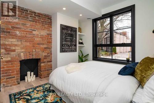 121 Sorauren Avenue, Toronto (Roncesvalles), ON - Indoor Photo Showing Bedroom With Fireplace