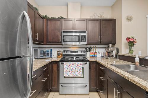 310-1350 Ridgeway Drive, Kelowna, BC - Indoor Photo Showing Kitchen With Stainless Steel Kitchen With Double Sink