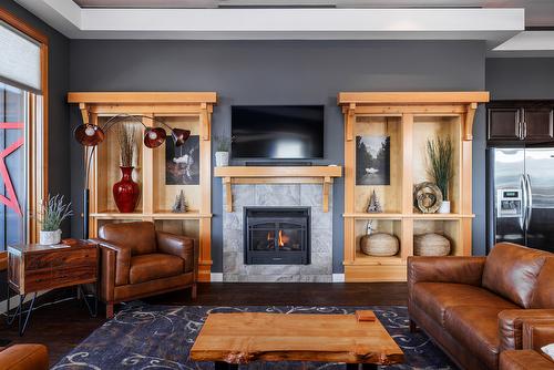 9864 Cathedral Drive, Silver Star, BC - Indoor Photo Showing Living Room With Fireplace