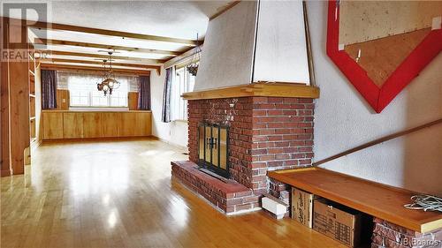 18 Chemin Du Clos, Maisonnette, NB - Indoor Photo Showing Other Room With Fireplace