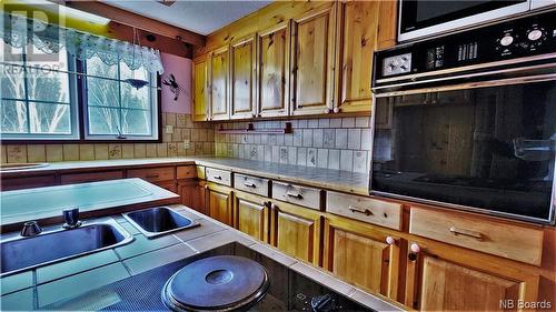 18 Chemin Du Clos, Maisonnette, NB - Indoor Photo Showing Kitchen With Double Sink