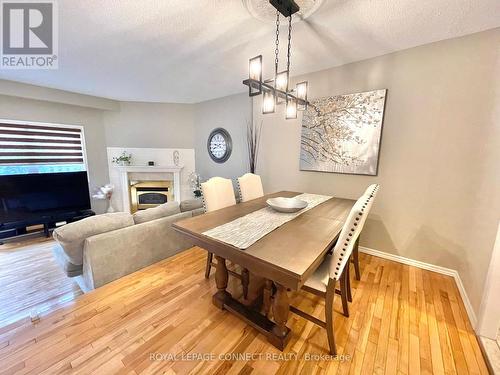 68 - 525 Meadows Boulevard, Mississauga (Rathwood), ON - Indoor Photo Showing Dining Room With Fireplace