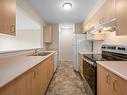 104-840 Braidwood Rd, Courtenay, BC  - Indoor Photo Showing Kitchen With Double Sink 