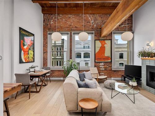 317-599 Pandora Ave, Victoria, BC - Indoor Photo Showing Living Room With Fireplace