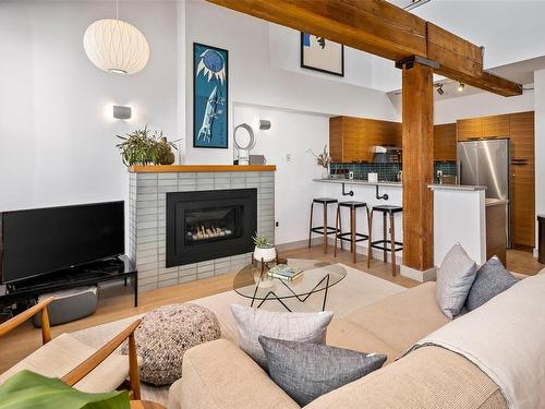 317-599 Pandora Ave, Victoria, BC - Indoor Photo Showing Living Room With Fireplace