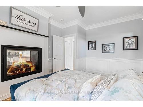 37 Grayview Dr, Grey Highlands, ON - Indoor Photo Showing Bedroom With Fireplace