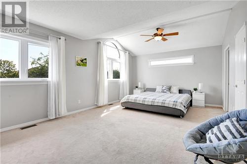 Huge primary bedroom 13'x21'2" with ceiling fan and large windows, en-suite and walk-in closet - 31 Forillon Crescent, Ottawa, ON - Indoor Photo Showing Bedroom