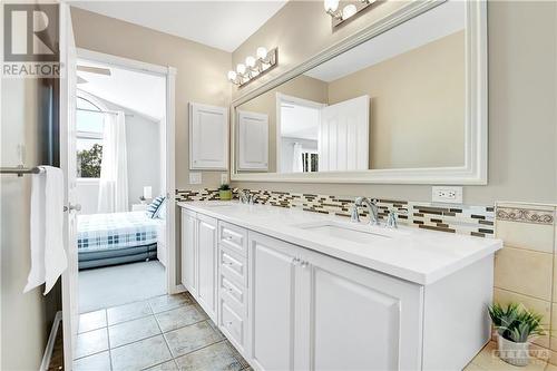 Double sink en-suite with quartz countertop, soaking tub and shower - 31 Forillon Crescent, Ottawa, ON - Indoor Photo Showing Bathroom