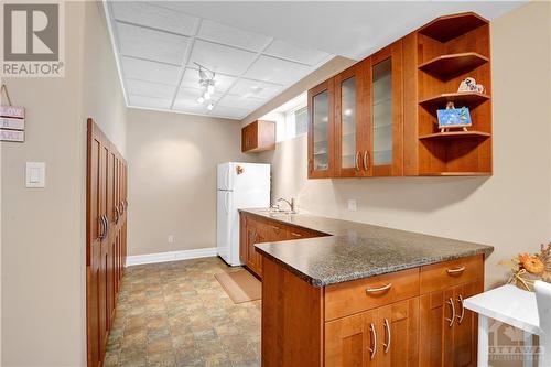 Kitchenette area with fridge #2 included and lots of storage - 31 Forillon Crescent, Ottawa, ON - Indoor Photo Showing Kitchen