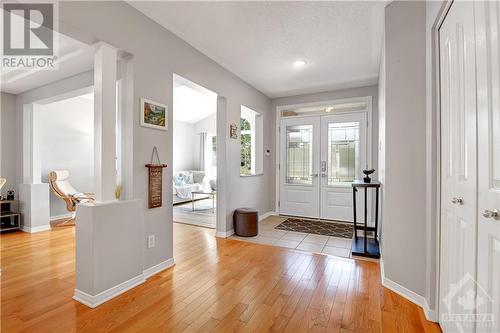 Beautiful double entrance door with keyless electronic door lock (2023), hardwood floor, pot lights, lots of light due to large windows - 31 Forillon Crescent, Ottawa, ON - Indoor Photo Showing Other Room